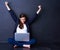 Business couldnt be better. Shot of a happy businesswoman looking at her laptop while raising her hands in excitement.