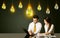 Business couple with idea bulbs