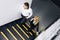 Business couple with mobile phone on the stairs in office