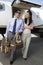 Business Couple Walking Together At Airfield