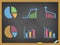 Business diagram icons on blackboard