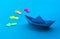 Business direction with boat paper and arrow on blue background.investment success concepts ideas