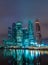 Business district of the Moscow in colorful night lights. The roofs of the buildings in the fog