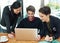 Business doesnt have to be serious all the time. a team of businesspeople discussing work at a desk in their office.