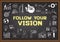 Business doodle about follow your vision on chalkboard.