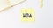 Business educatuion concept. yellow paper sticker with text MBA acronym on yellow paper note with clips and corner of notebook on