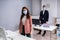 Business Employees In Office Wearing Medical Masks