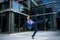 Business excitement. Business man keeping arms raised and expressing positivity outdoors. Businessman jumping for joy