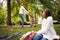 Business father spinning a daughter in park