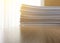 Business file documents paper stack on office wood table