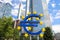 Business and finance concept with giant Euro sign at European Central Bank headquarters in the morning, business district in