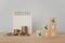 Business and finance concept increasing percentage on wooden cube block and blurred stack of coins and white calendar