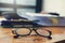 Business and finance concept of office working,Closeup eyeglasses on office desk