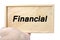 Business and financial concept. hand holding plain wood with word financial