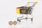 Business and financial, Shopping concept with shopping cart full with multi coins