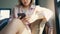 Business freelance Asian woman using smartphone for talking, reading and texting while sitting on table in cafe. Lifestyle smart