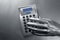 Business futuristic silver hand calculator