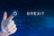 Business hand clicking brexit or british exit button