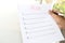 Business hand writing plans list in piece of paper