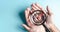 Business hands holding target icon on magnifier, dartboard and arrow for creative and set up business objective target goal,