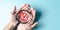 Business hands holding target icon on magnifier, dartboard and arrow for creative and set up business objective target goal,