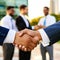 Business handshake of a businessman in front to the partners