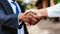 Business handshake of senior age businesspeople