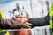 Business handshake in a shipyard. Shipbuilding industry