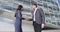 Business Handshake - Smiling Male And Female Partners Shaking Hands Greeting