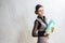 Business ideas. Portrait of Optimistic Caucasian Brunette Businesswoman Posing with Folders Indoors