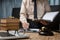 Business lawyer working hard at office desk workplace with book