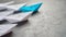 Business leadership Concept, Paper Boat, the key opinion Leader, the concept of influence. One blue paper boat as the Leader,