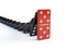 Business, leadership and teamwork concept - Red domino stops falling other dominoes