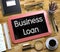 Business Loan - Text on Small Chalkboard. 3D.