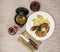 Business lunch : Petite Wiener schnitzel with boiled potatoes and ketchup. Served on a white porcelain plate with fork and knife o