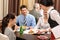 Business lunch restaurant waitress serving woman