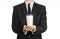 Business lunches coffee theme: businessman in a black suit holding a white blank paper cup of coffee with a brown plastic cap isol