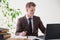 Business man in a business suit portrait work in Office talks