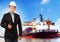 Business man and comercial ship with container on port