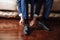 Business man dressing up with classic, elegant shoes. Groom wearing on wedding day, tying the laces and preparing.