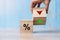 Business man Hand change wood cube block with percentage to UP and Down arrow symbol icon. Interest rate, stocks, financial,