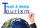 Business man hand writing Health Medical tourism over Earth (Earth map furnished by NASA)