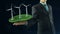 Business man has on hand green energy concept build animation windmill black