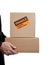 Business man holding cardboard moving box on white