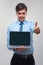 Business man holding a laptop against a white background