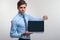 Business man holding a laptop against a white background