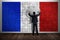 Business man holding piece of puzzle, making french flag