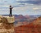 Business man looks through telescope on mountain