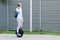 Business man male with electric transport unicycle