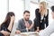 business man presenting and disagree sign  in meeting room . Group of young business people brainstorming together in office.